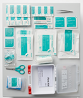 Collection of medical supplies including bandages, scissors, and a first aid kit on a white background.